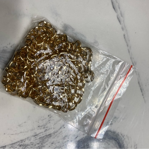 Muted gold clutch with tassel and cross body chain - Picture 6 of 6